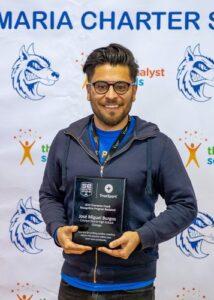 Jose Burgos posing with his SportsEngine Coaching Award.