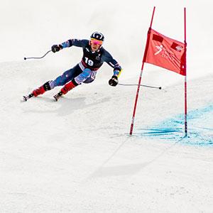 Tyler Carter downhill skiing during a competition.